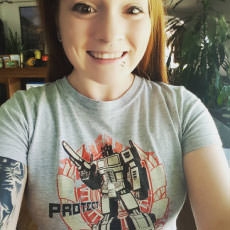 Geek Fuel unboxer with a Transformers shirt